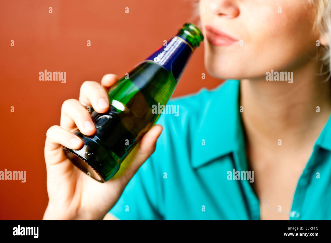 Teenage girl drinking alcohol. Stock Photo