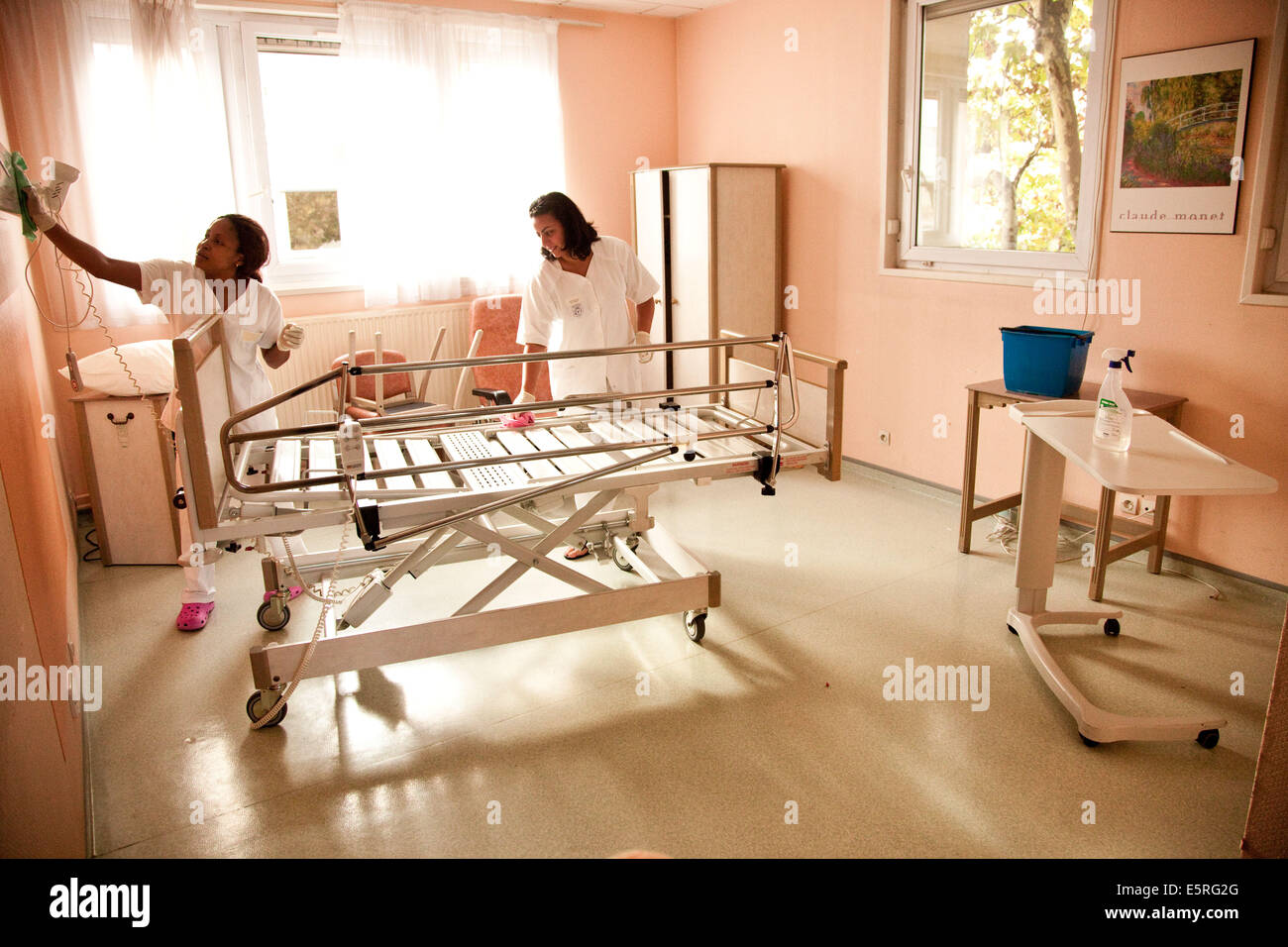 Staff cleaning a room after the death of a patient, Palliative care