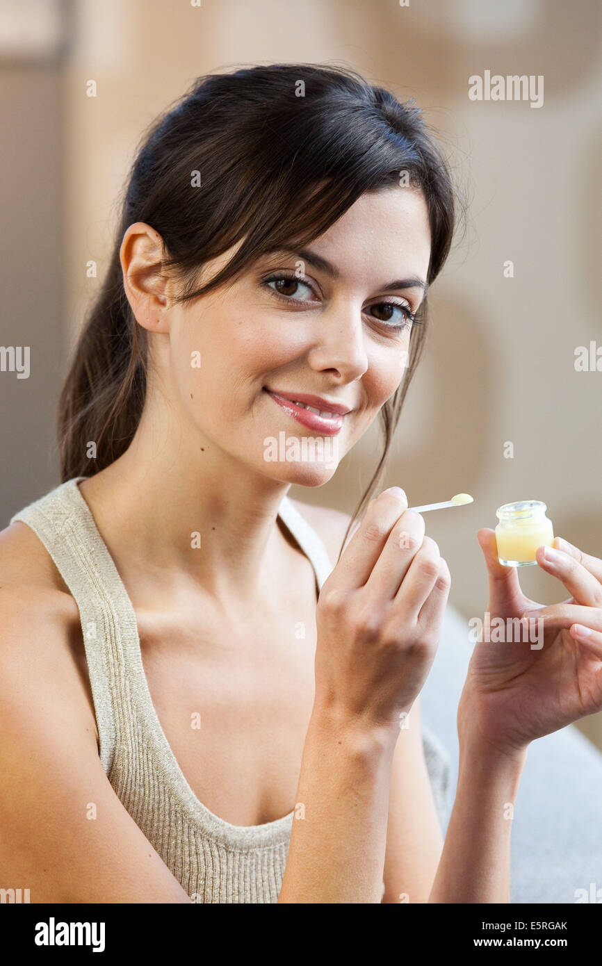 Woman eating royal jelly Stock Photo Alamy