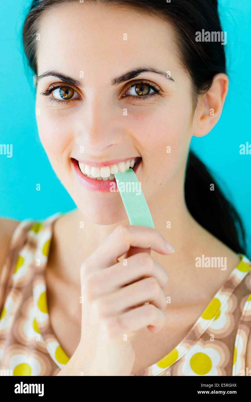 Woman with chewing gum. Stock Photo