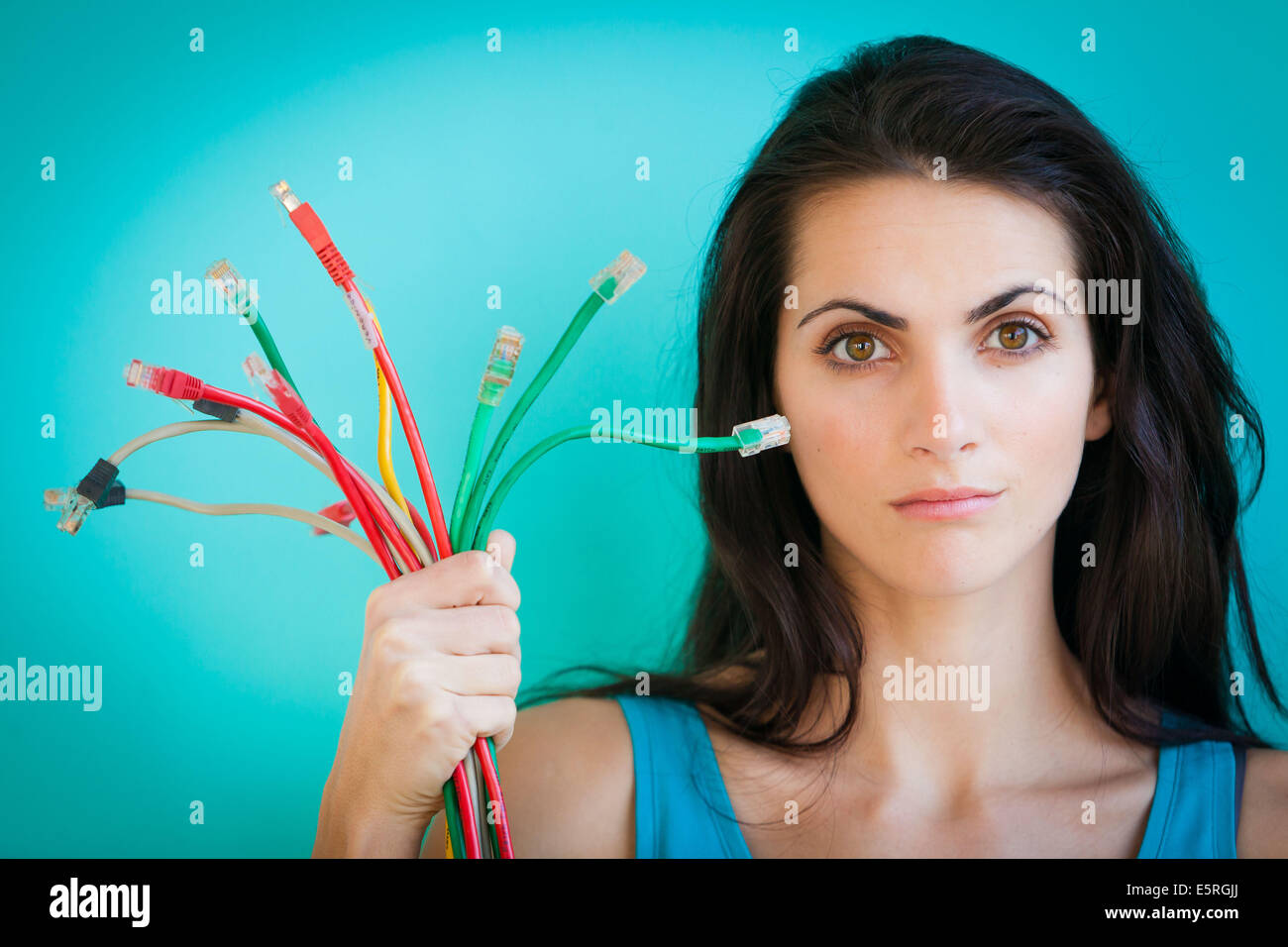Woman holding ethernet cables. Stock Photo