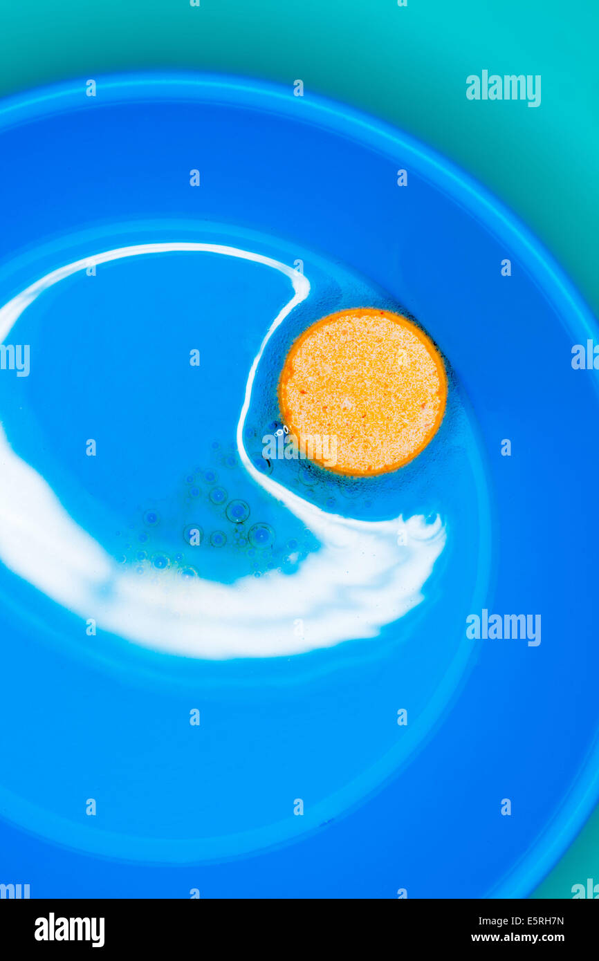 Vitamin C tablet dissolving in a glass of water Stock Photo Alamy