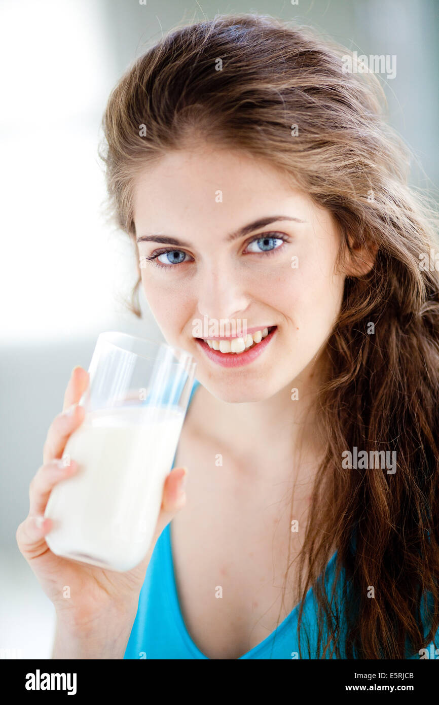 Woman drinking a glass of milk Stock Photo Alamy