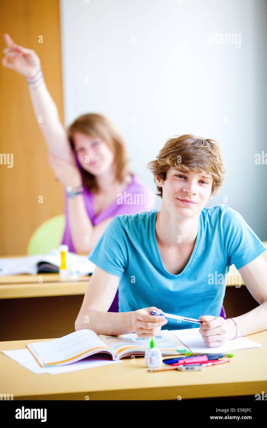 Teenagers in a classroom Stock Photo - Alamy