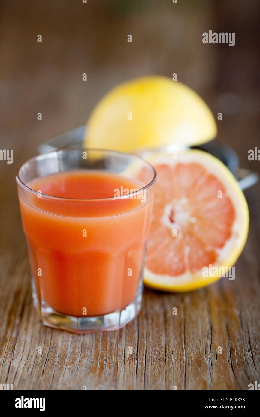 Grapefruit juice in glass Stock Photo Alamy