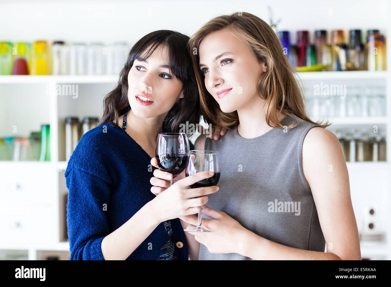 Women drinking a glass of red wine. Stock Photo