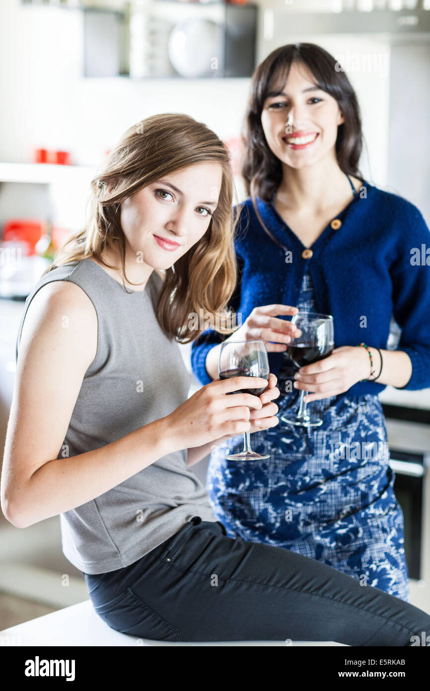 Women drinking a glass of red wine. Stock Photo