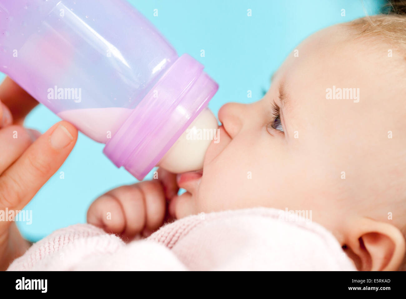 5 month old baby with feeding bottle 
