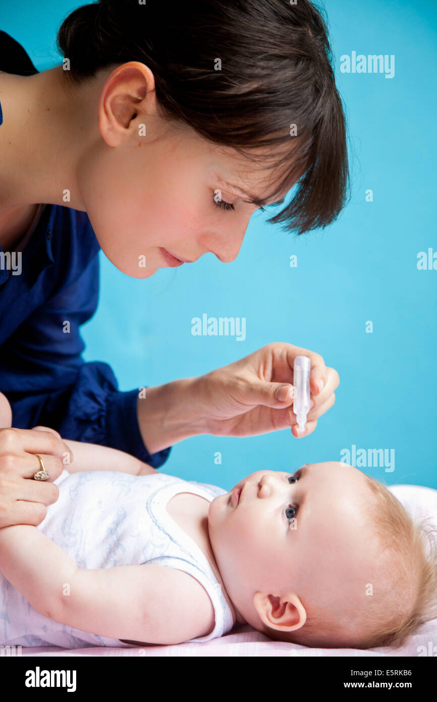 Baby drops in the eye hires stock photography and images Alamy