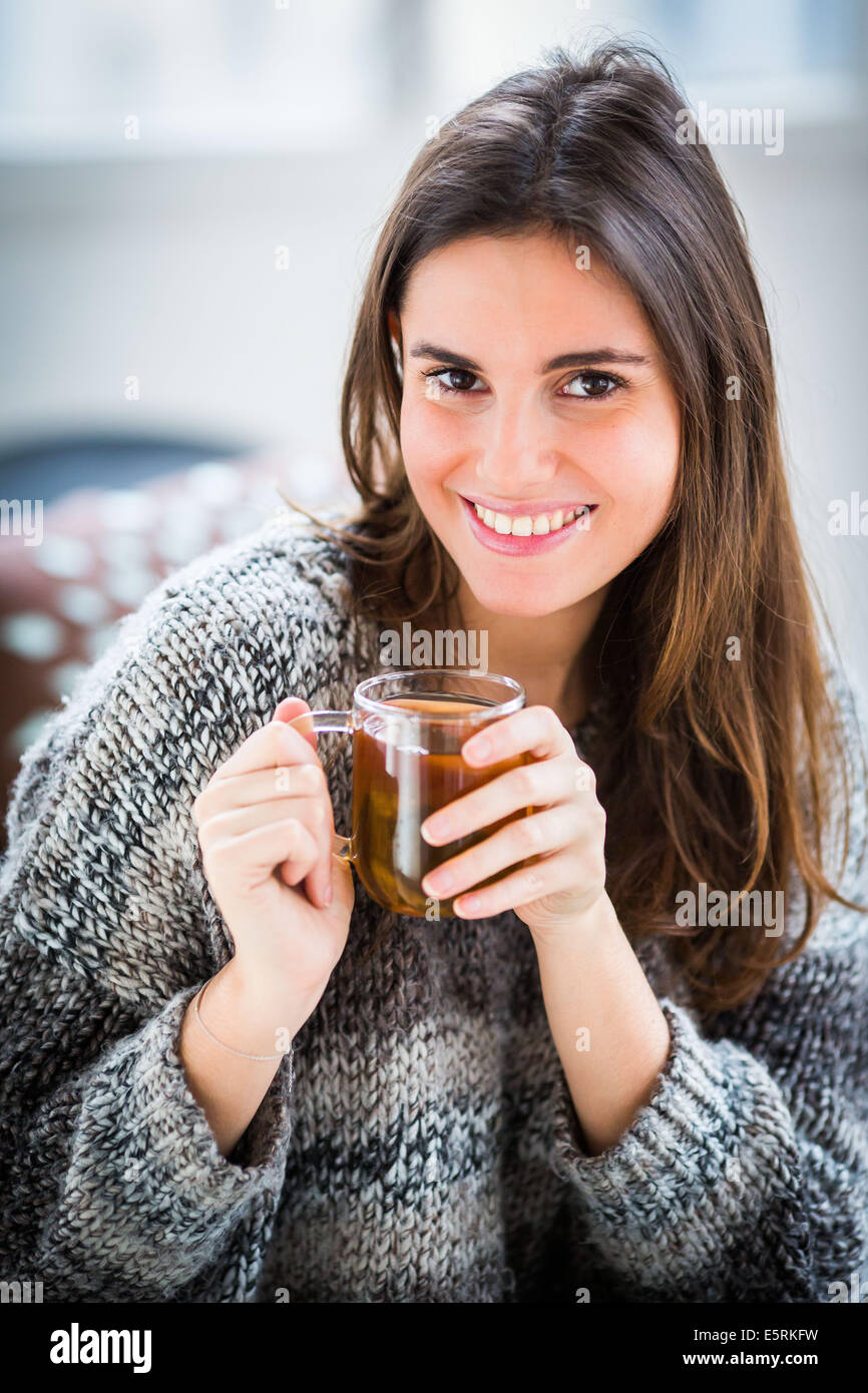 Woman drinking hot beverage Stock Photo - Alamy