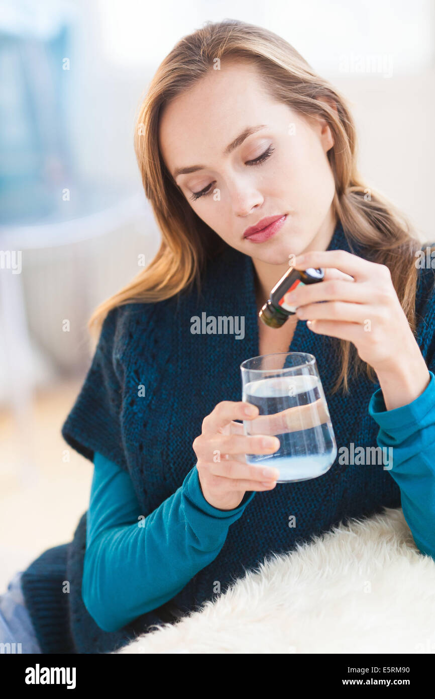 Woman taking medication. Stock Photo