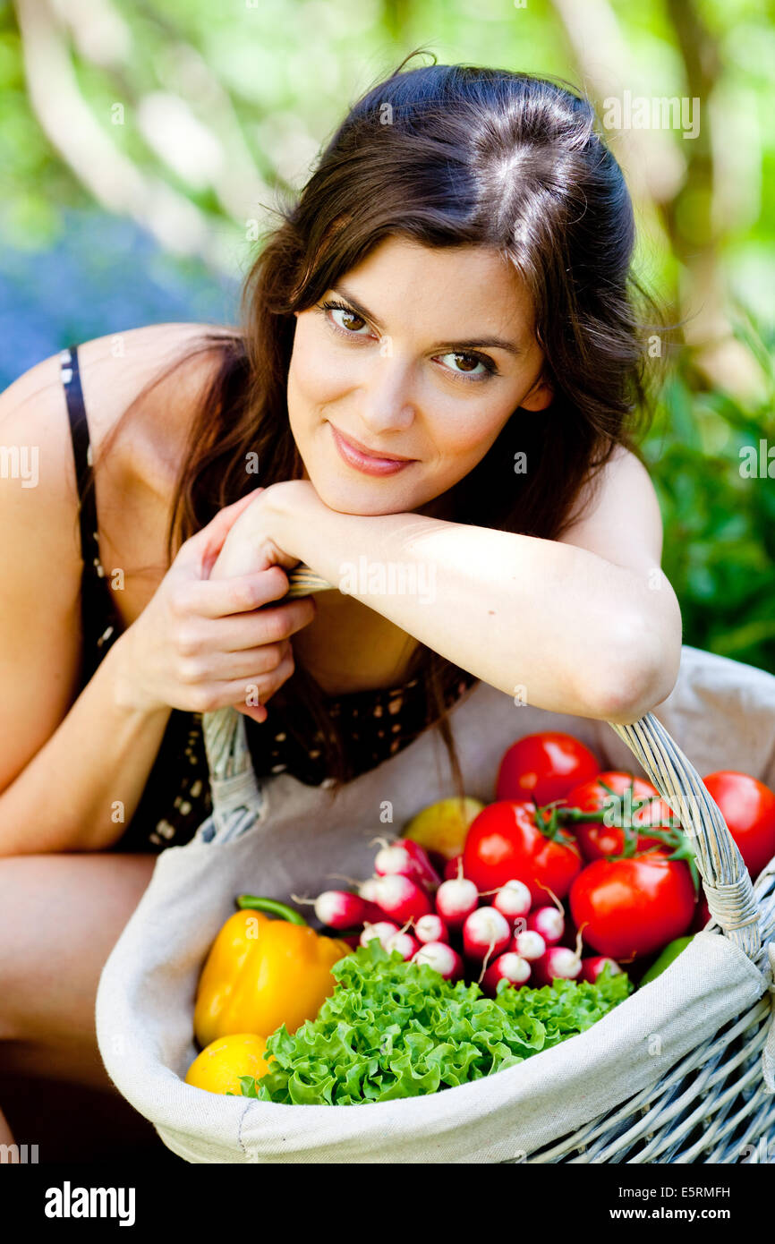 Woman with vegetables basket Stock Photo - Alamy