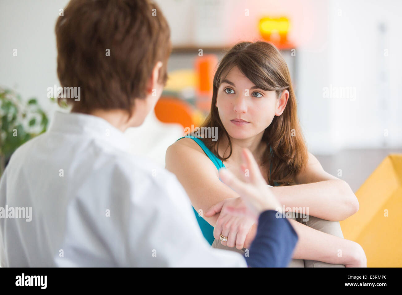 Doctor talking with a female patient Stock Photo - Alamy