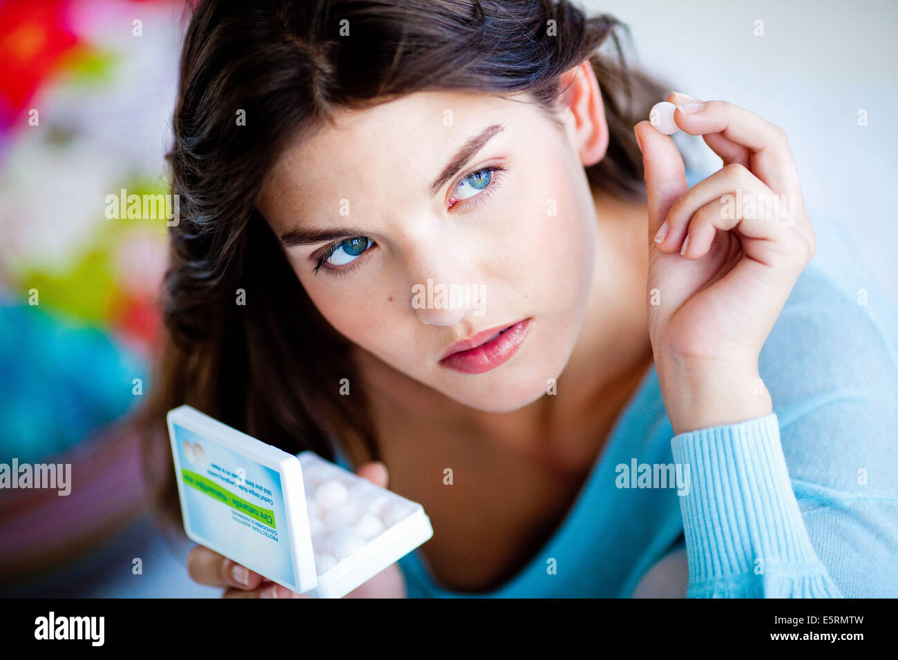 Woman wearing ear plug. Stock Photo