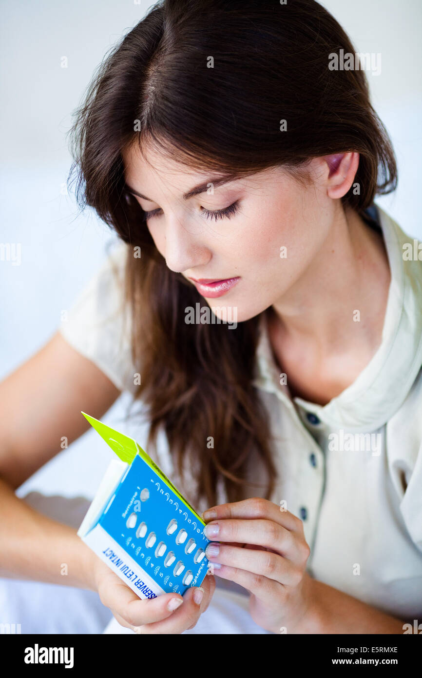 Woman holding Champix ( varenicline ), medicine specifically developed