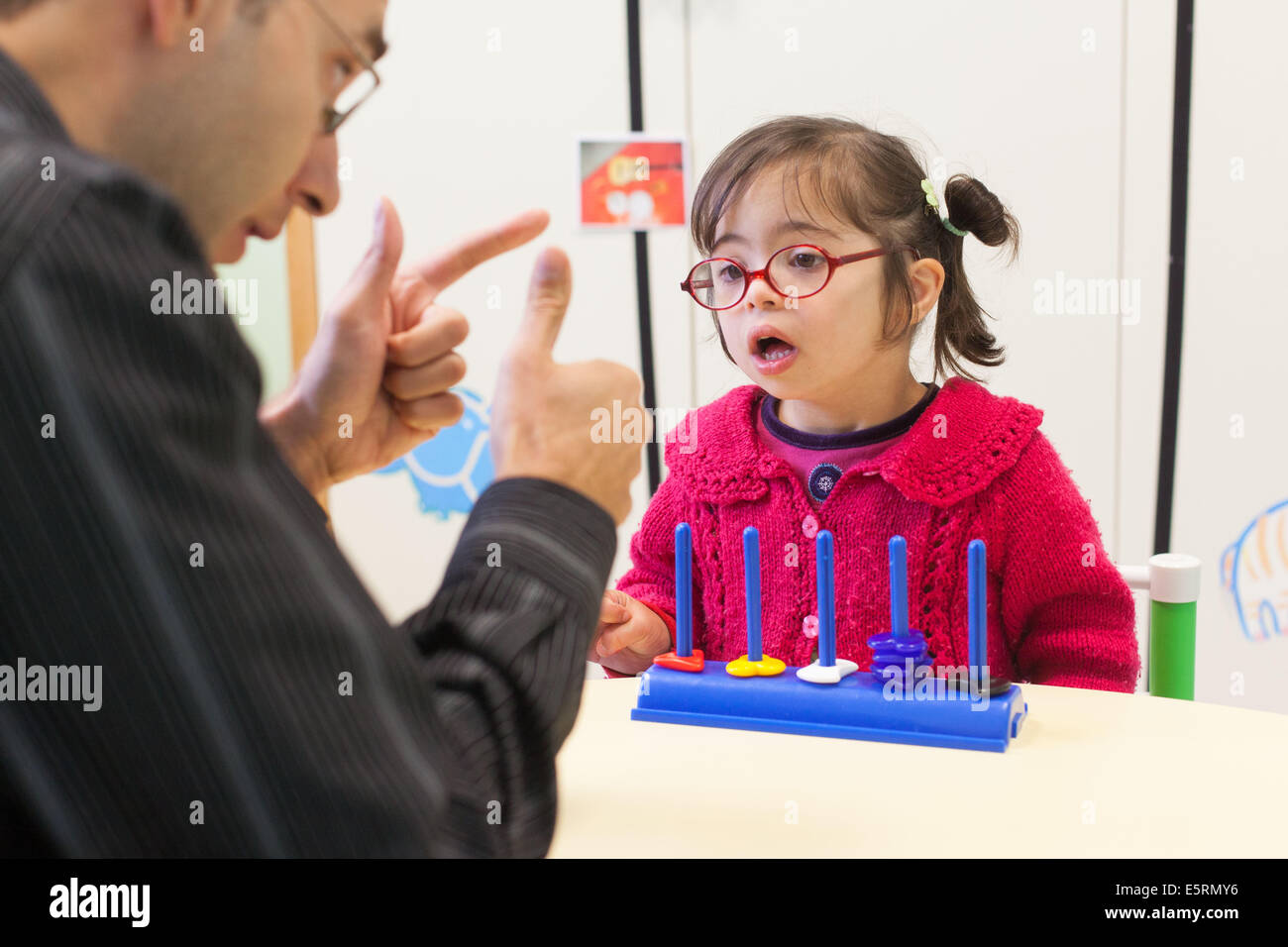 4 Year Old Girl Down S Syndrome During A Session With A Special Education Teacher Stock Photo Alamy 4 Year Old Girl Down S Syndrome During A Session With A Special Education Teacher Stock Photo Alamy