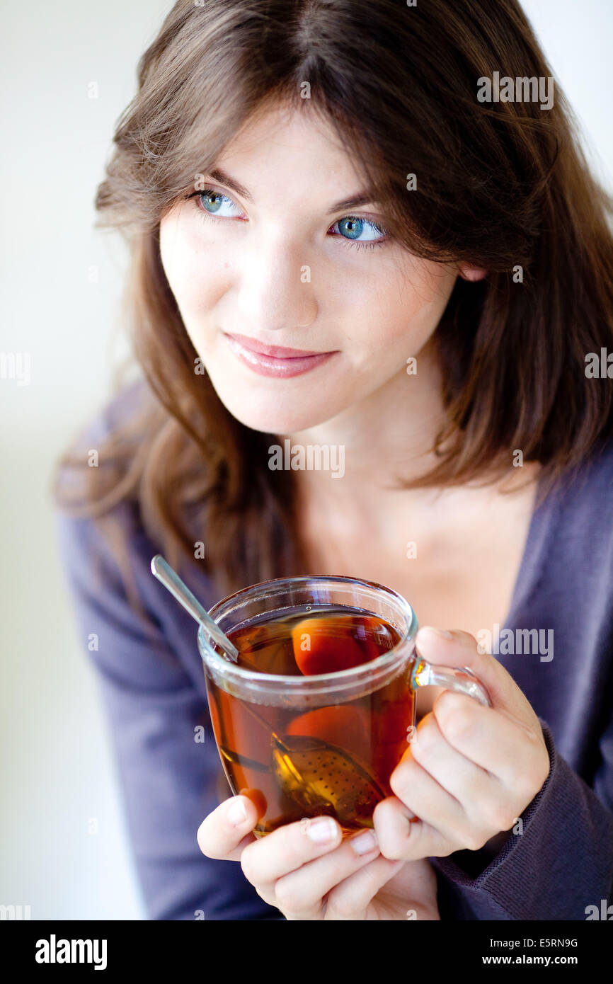 Woman drinking hot beverage Stock Photo Alamy