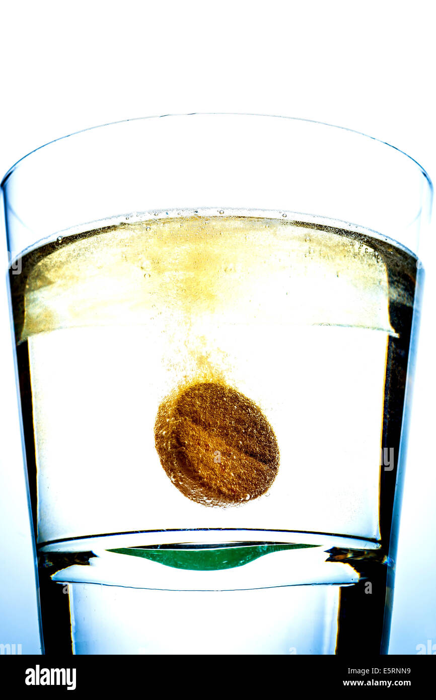 Vitamin C tablet dissolving in a glass of water Stock Photo Alamy