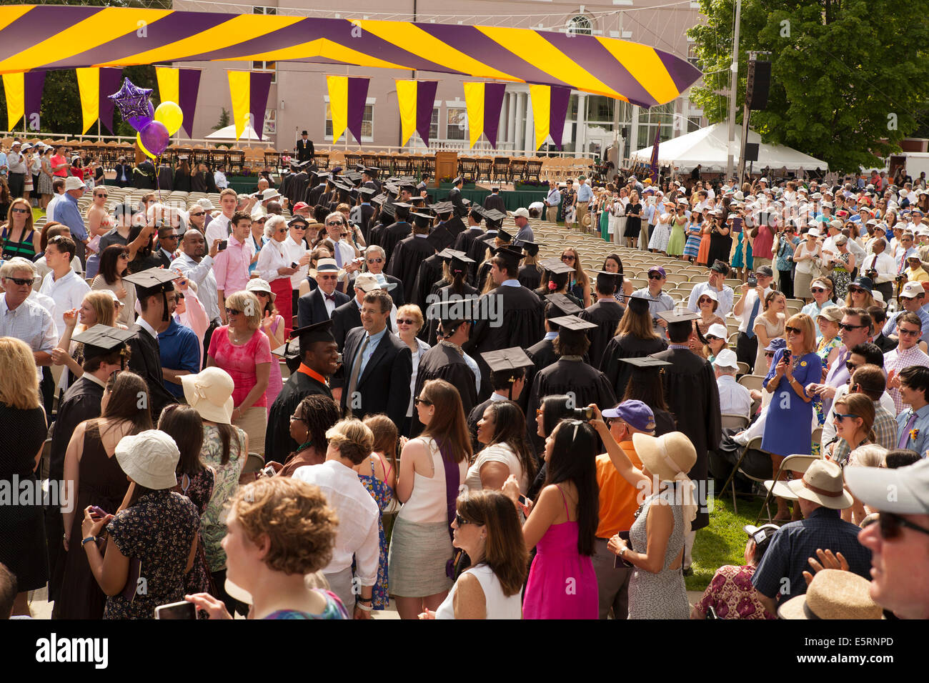 Graduating students parade into the seating area before their