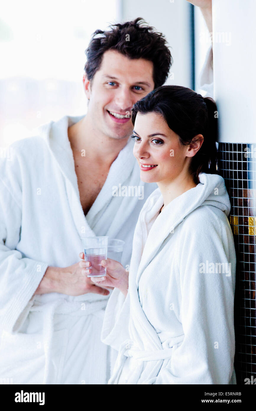 Couple wearing white bathrobe Stock Photo Alamy