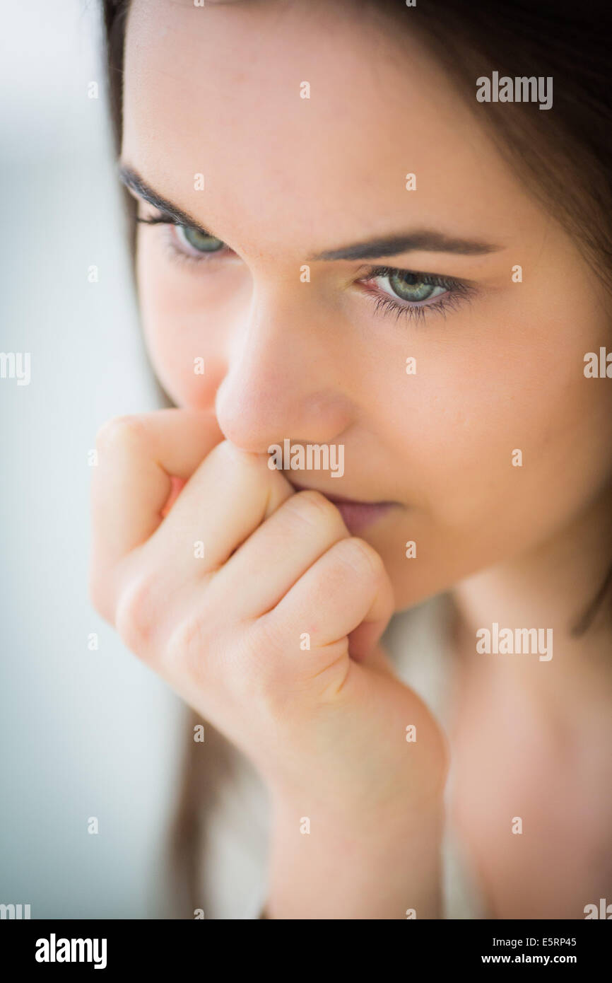 Woman with hand on her mouth. Stock Photo