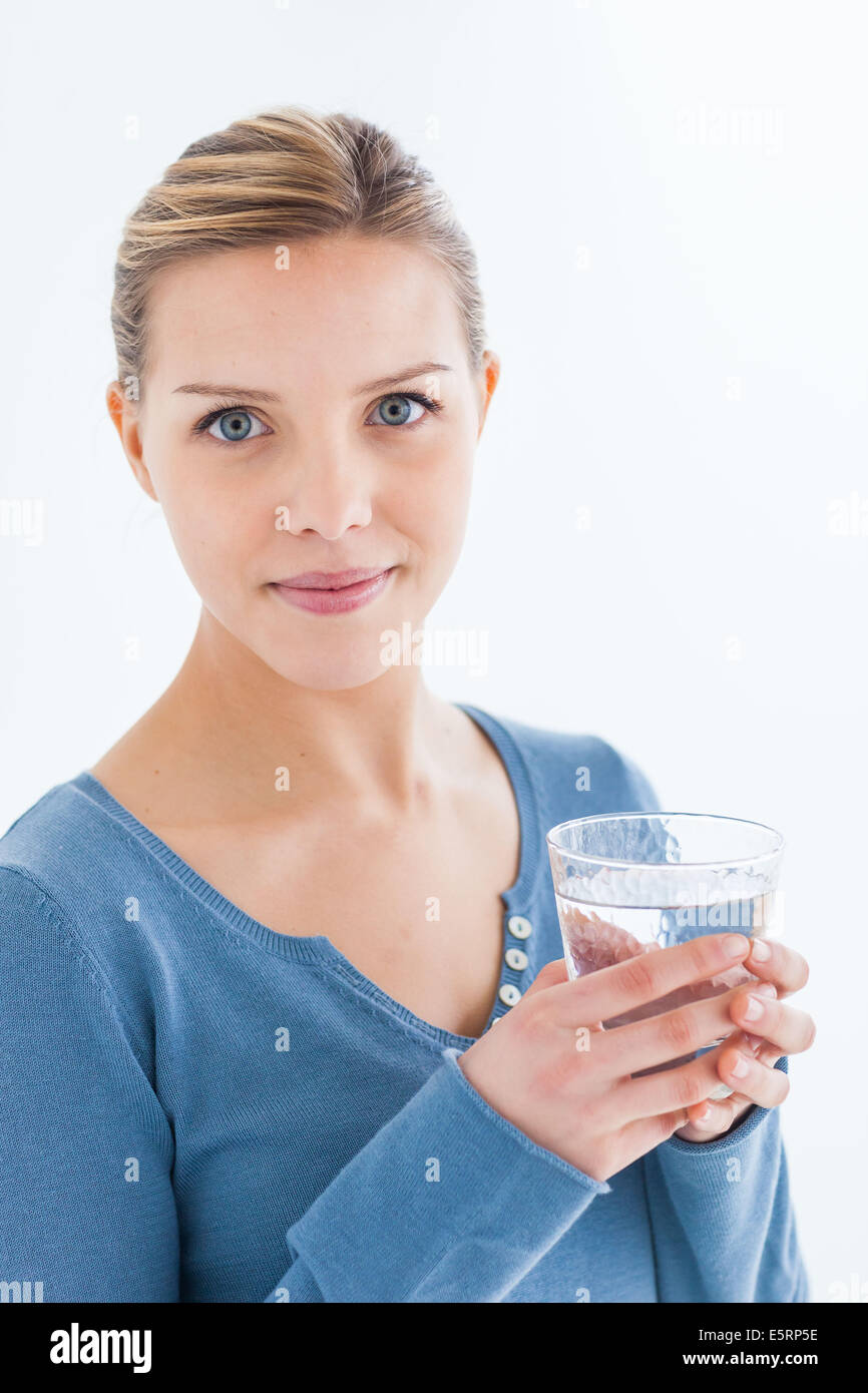 Woman drinking a glass of water Stock Photo Alamy