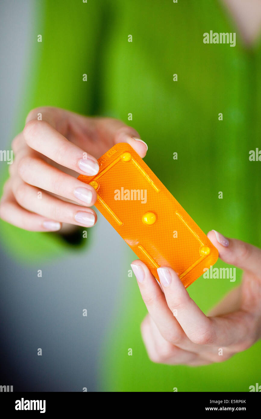 Woman holding Norlevo morning-after pill (emergency contraceptive pill). Stock Photo