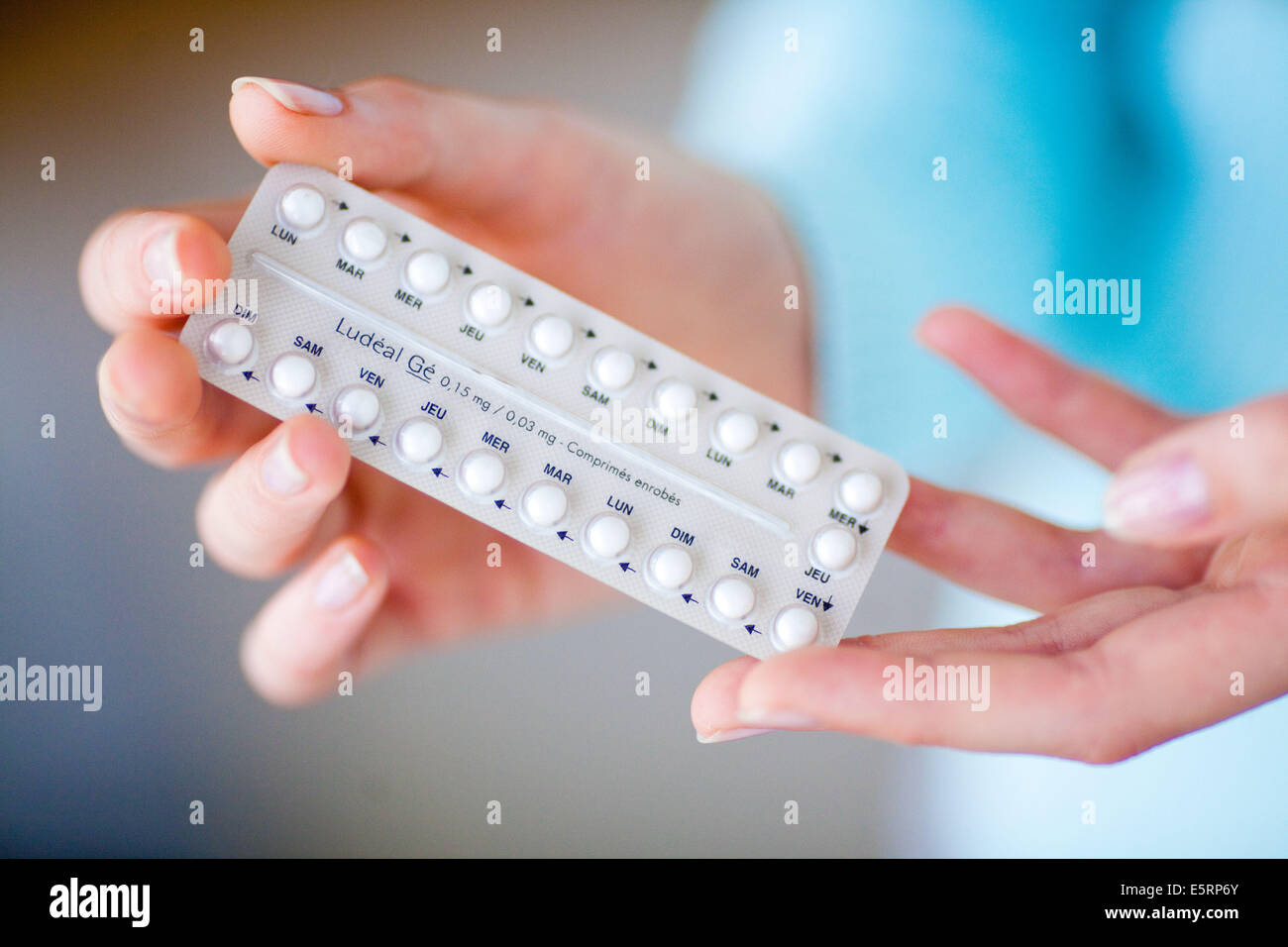 Woman with generic contraceptive pills. Stock Photo