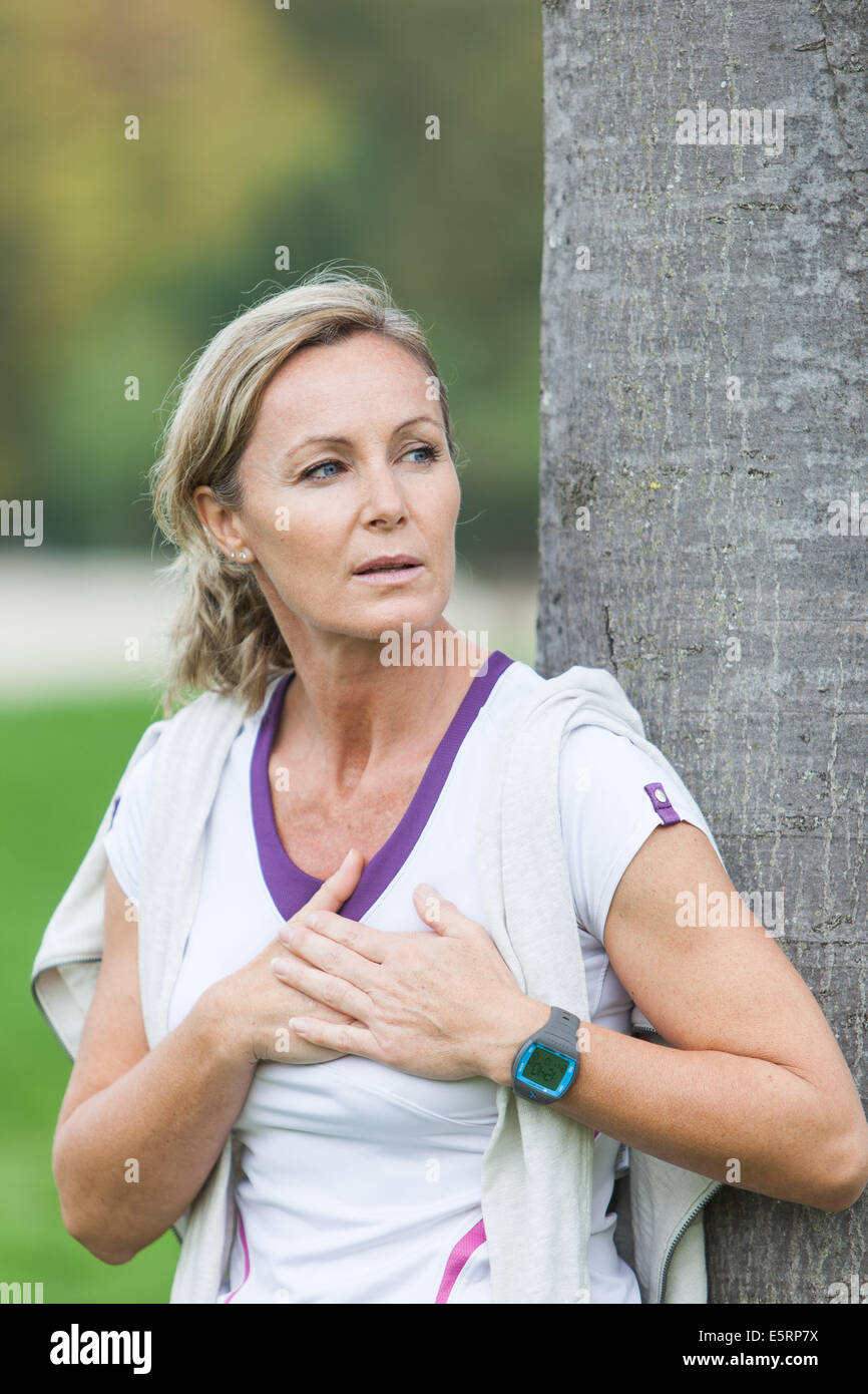 Woman out of breath because of physical activity. Stock Photo
