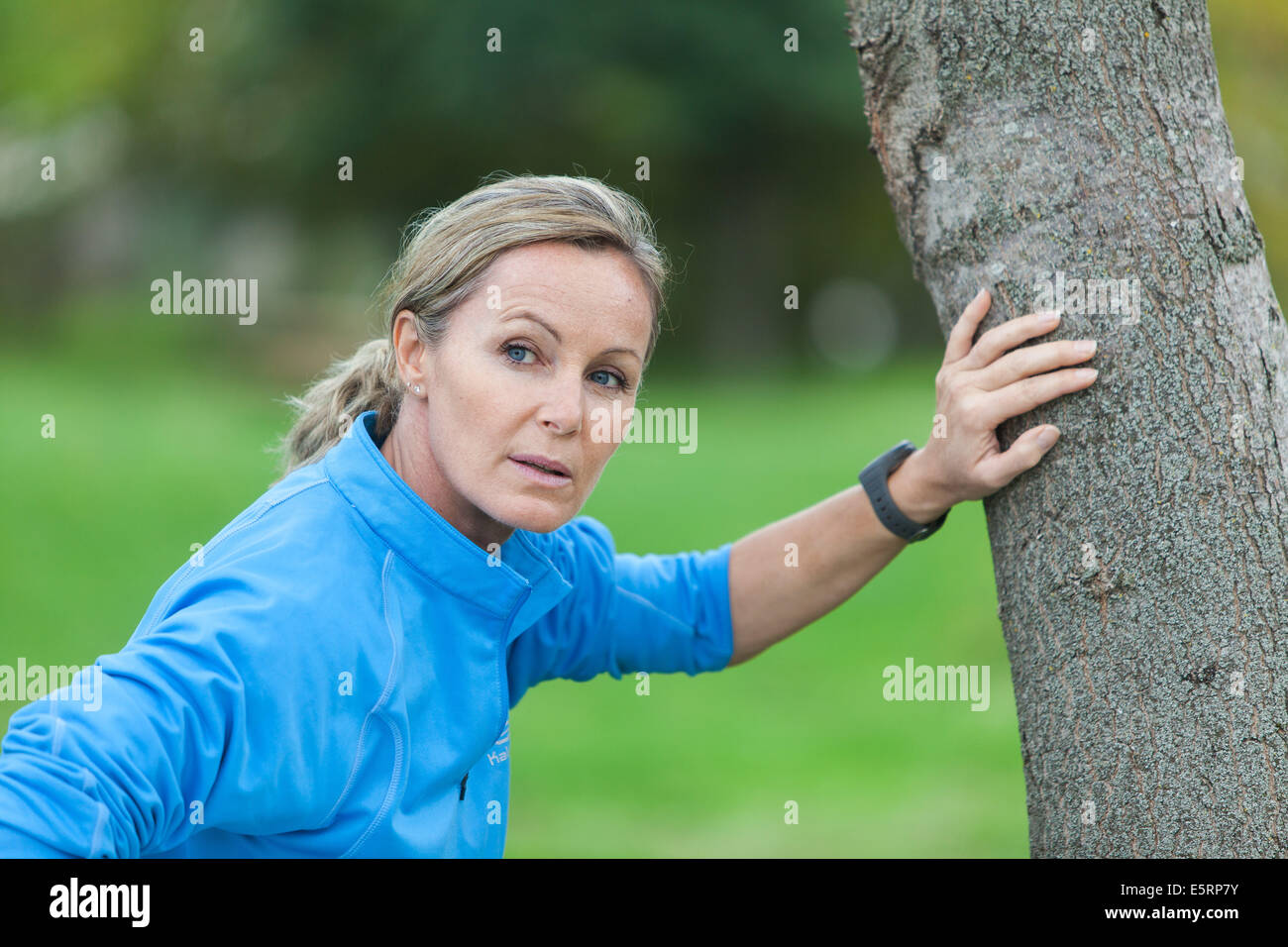 Woman out of breath because of physical activity. Stock Photo