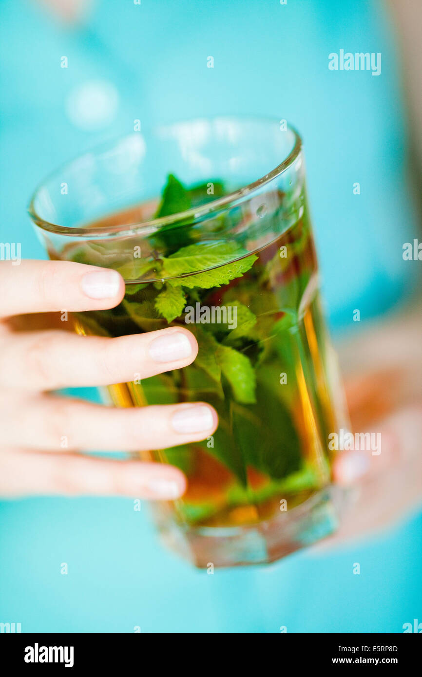 Woman drinking hot beverage Stock Photo Alamy