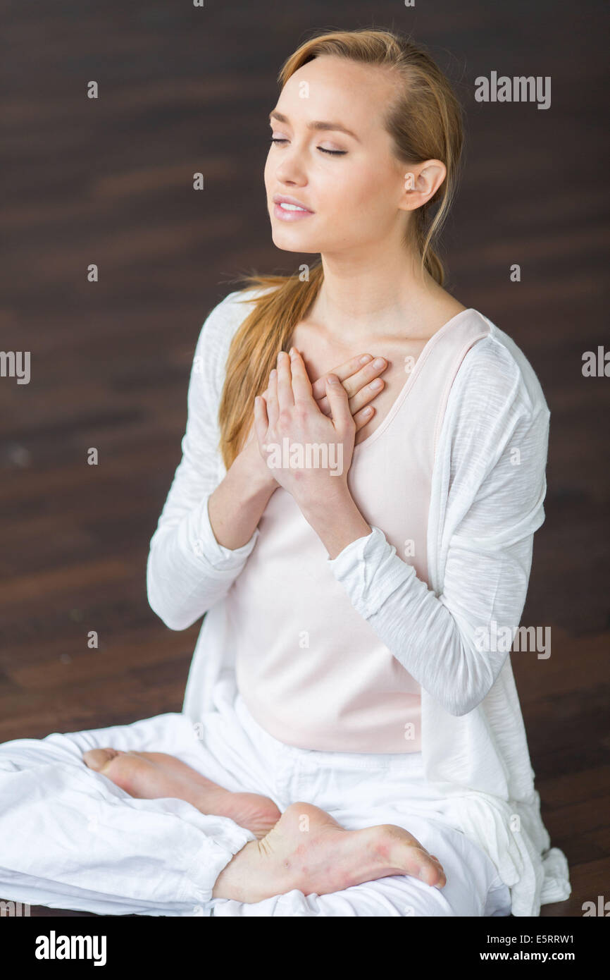 Woman practicing yoga. Stock Photo