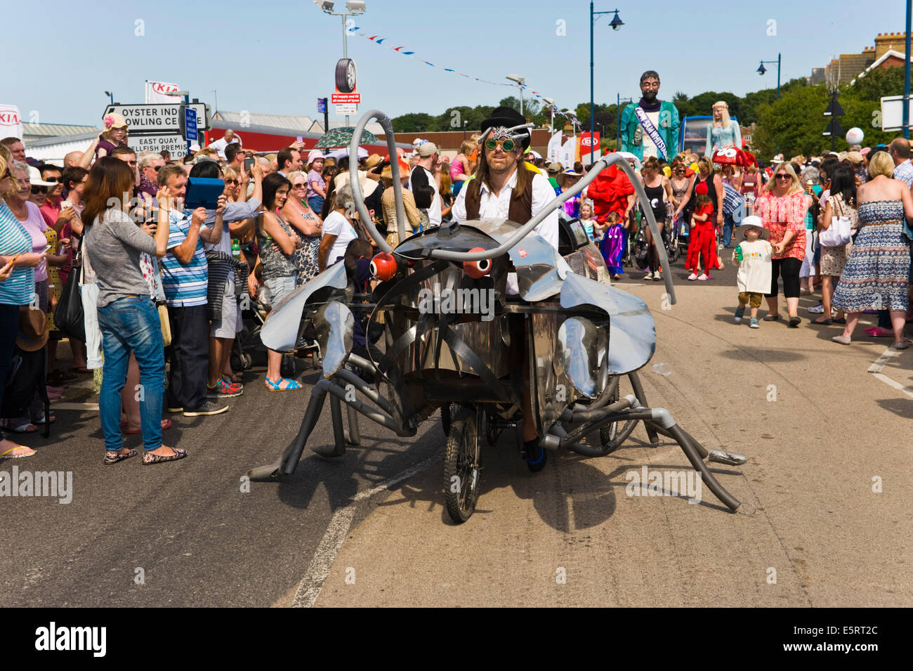 Carnival parade town centre during Whitstable Oyster Festival Kent England UK Stock Photo