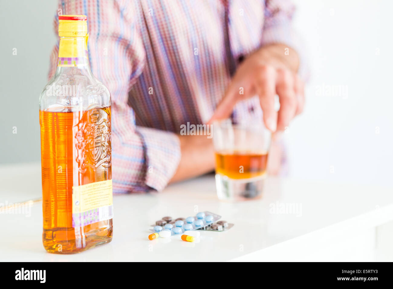 Wrong association of alcohol and medications. Stock Photo
