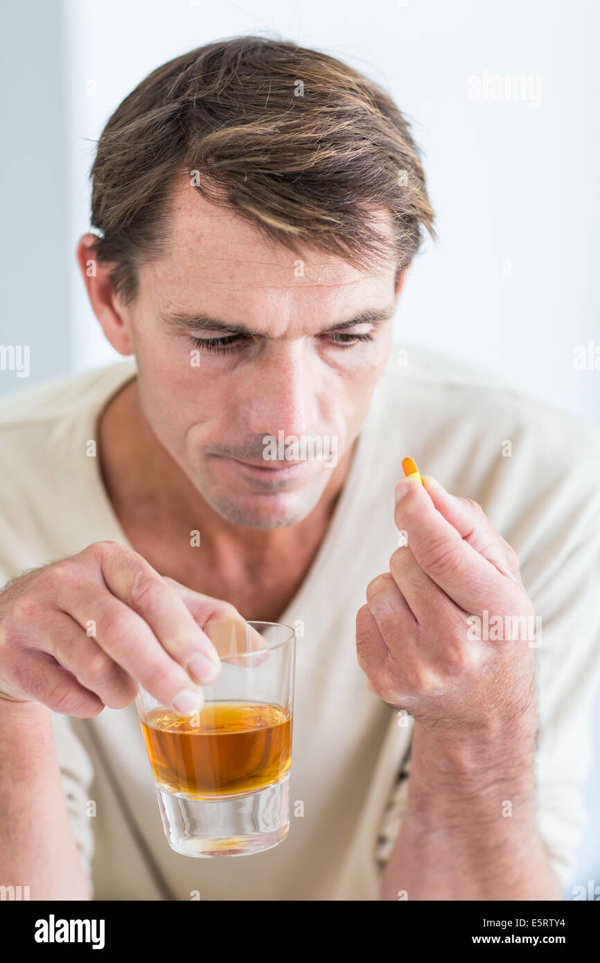 Wrong association of alcohol and medications. Stock Photo