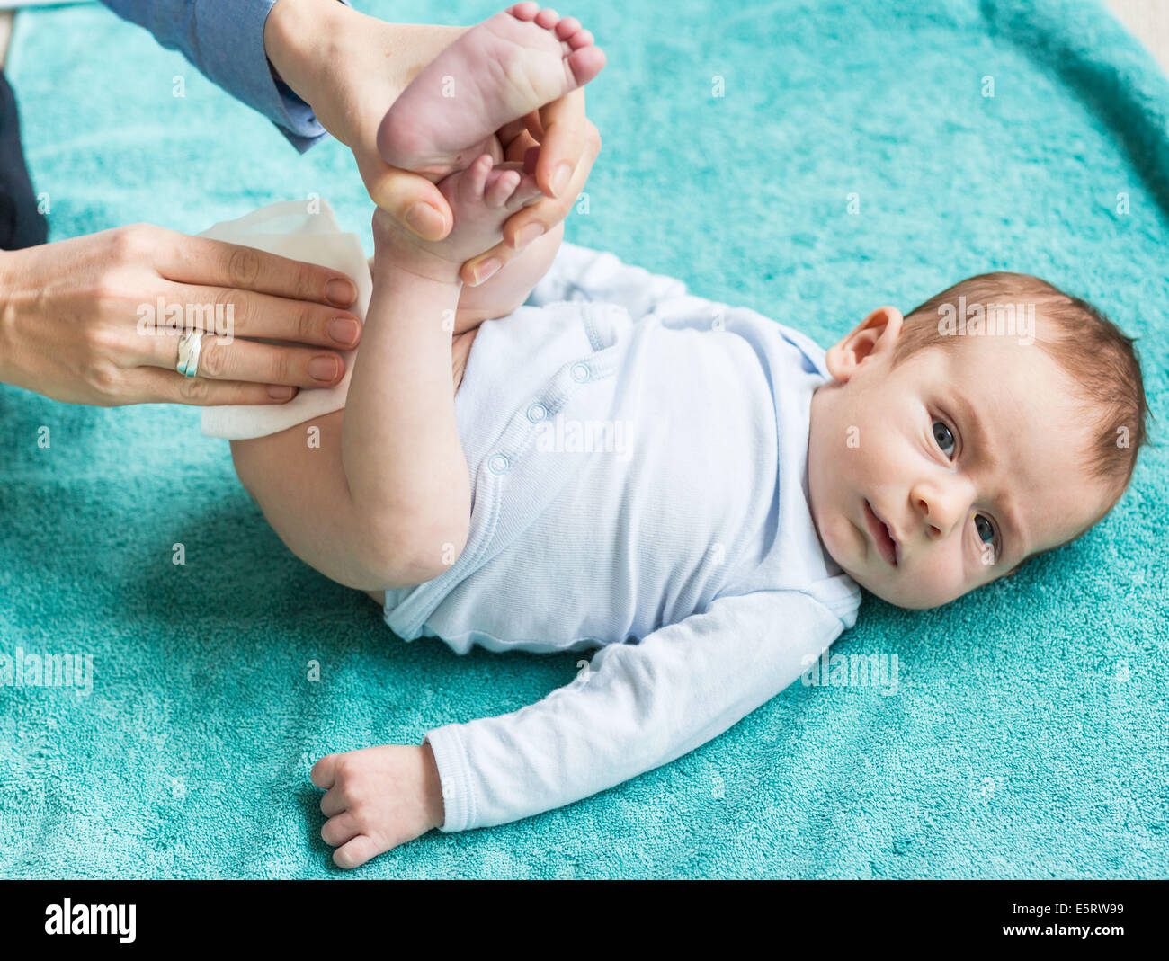 Using wipes for washing a 2 month old baby boy Stock Photo Alamy