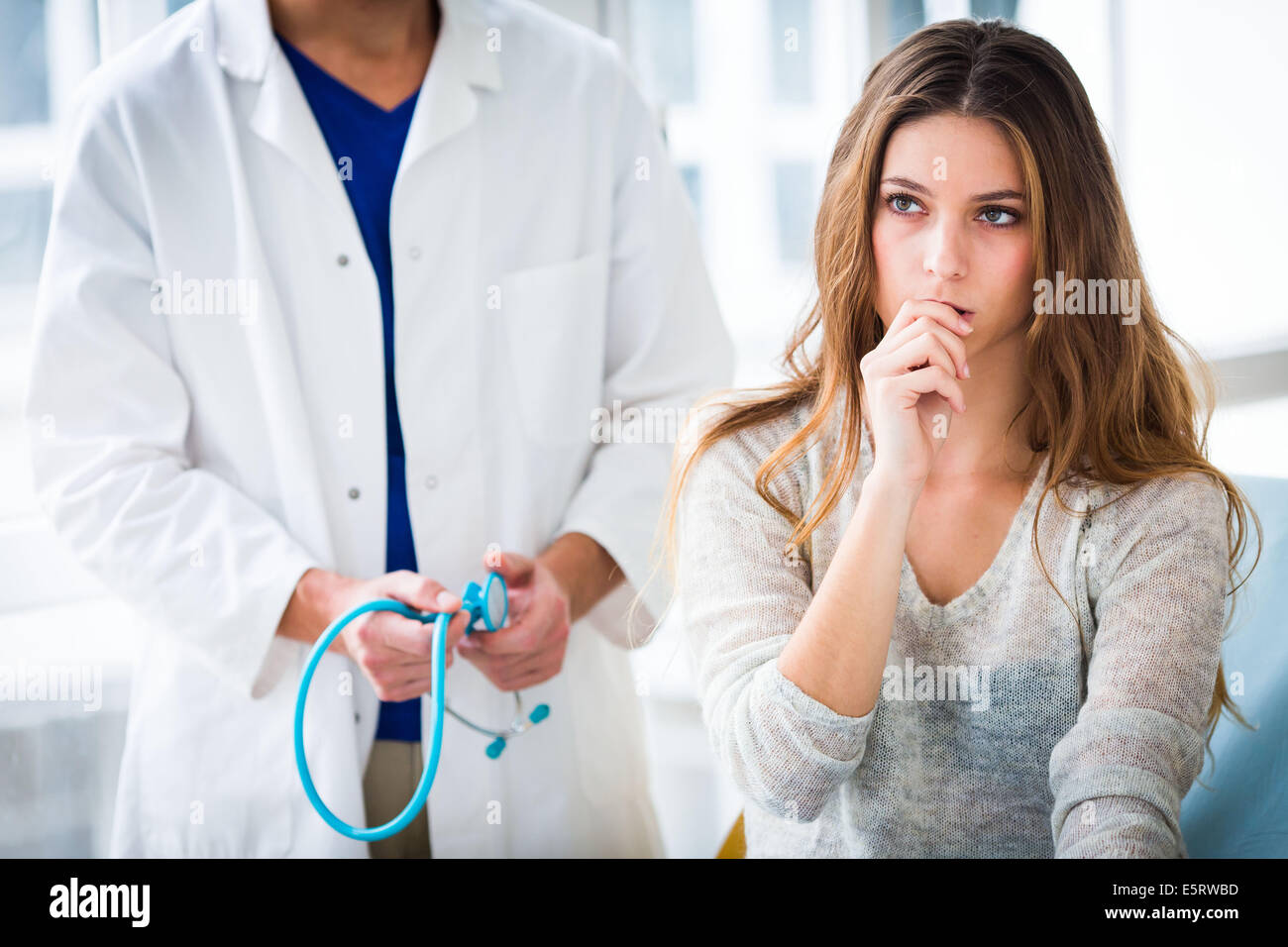 Doctor talking with a female patient. Stock Photo