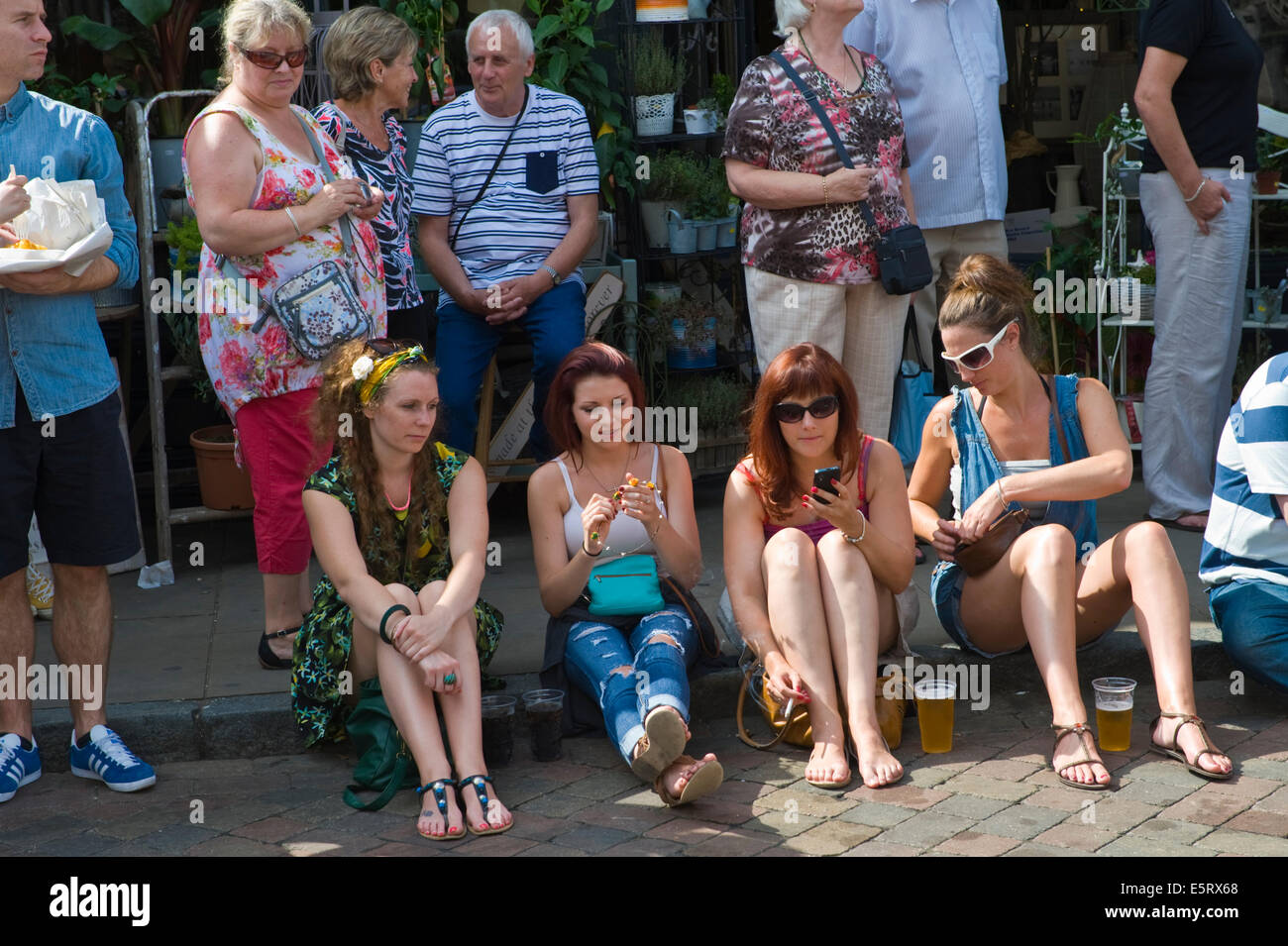 Visitors watching street parade at Whitstable Oyster Festival Kent England UK Stock Photo