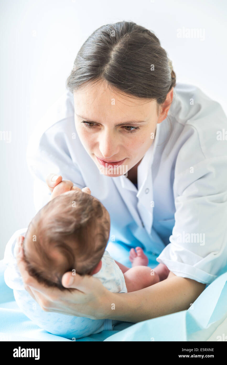 Three weeks old baby boy during pediatric consultation. Stock Photo