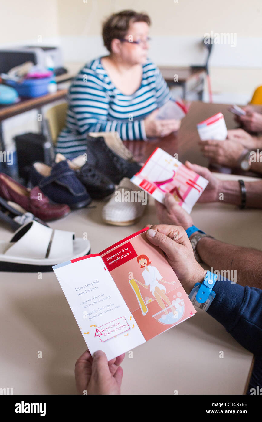 Diabetic patient participating in foot hygiene therapeutic education