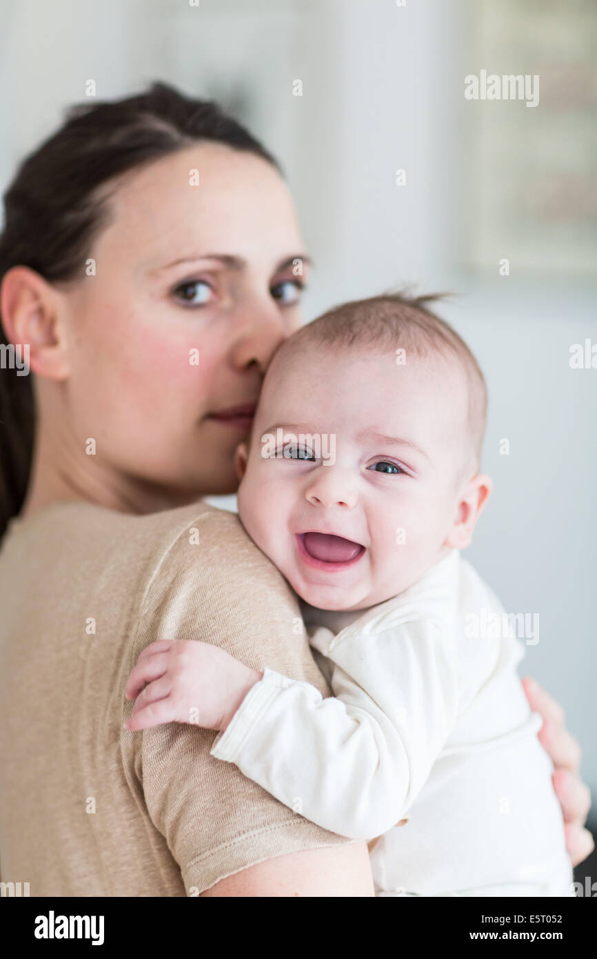 Mother holding her 4 month old baby boy Stock Photo Alamy