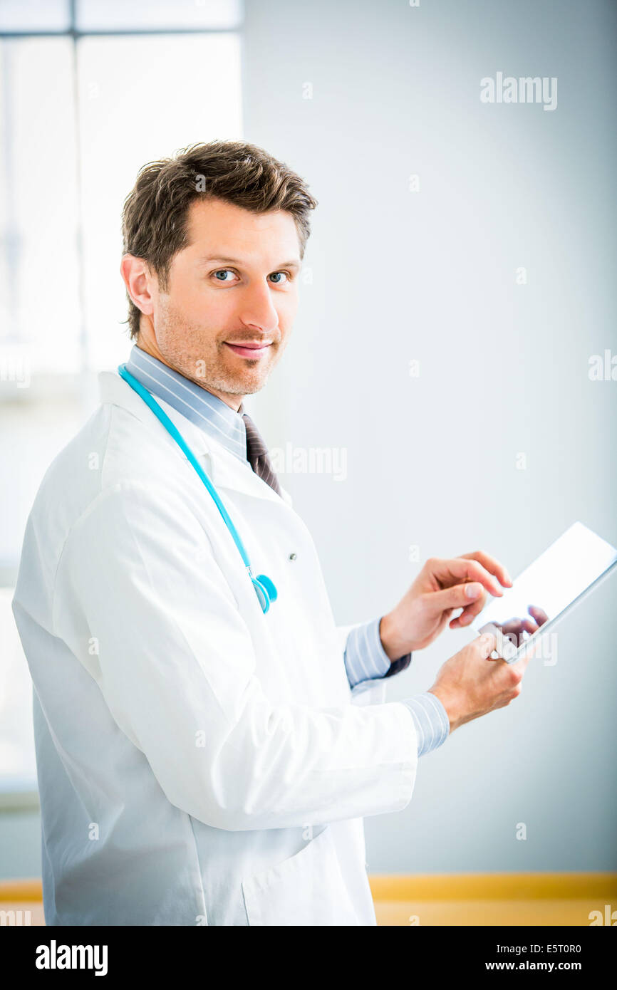 Doctor using a tablet PC. Stock Photo