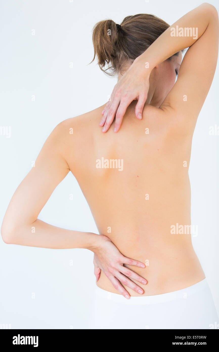 Woman suffering from neck and lumbar pain. Stock Photo