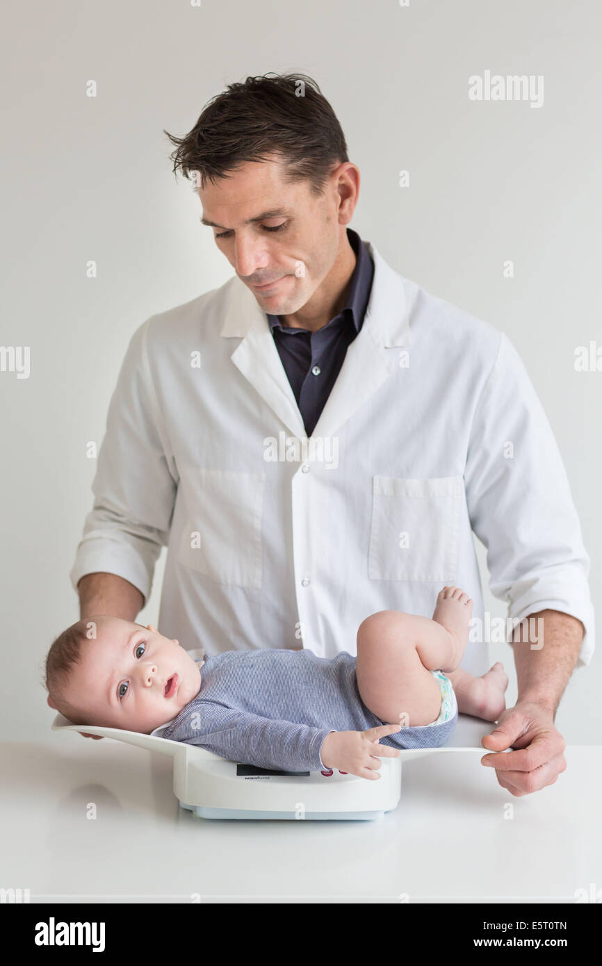 5 month old baby boy weighing. Stock Photo