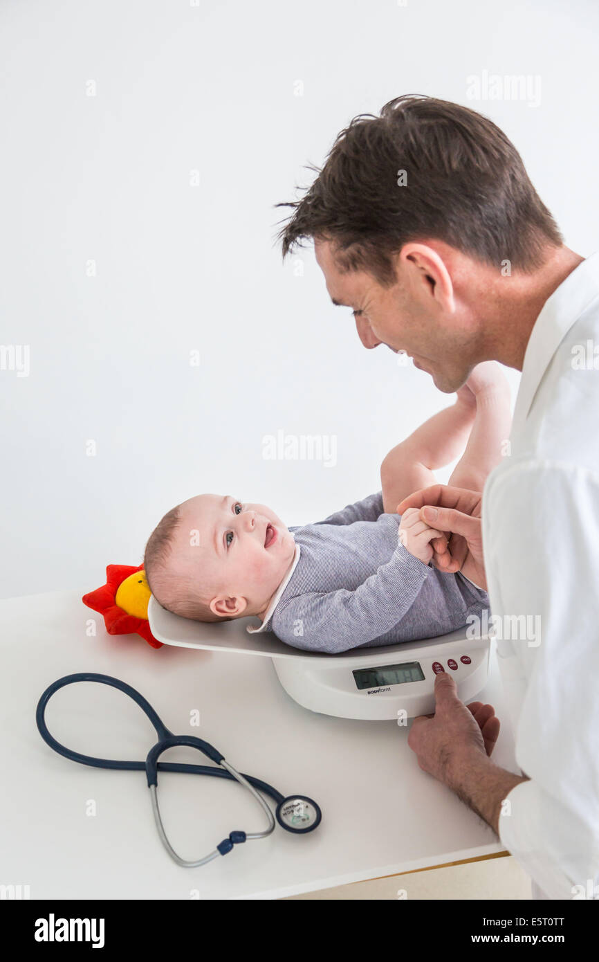 5 month old baby boy weighing. Stock Photo