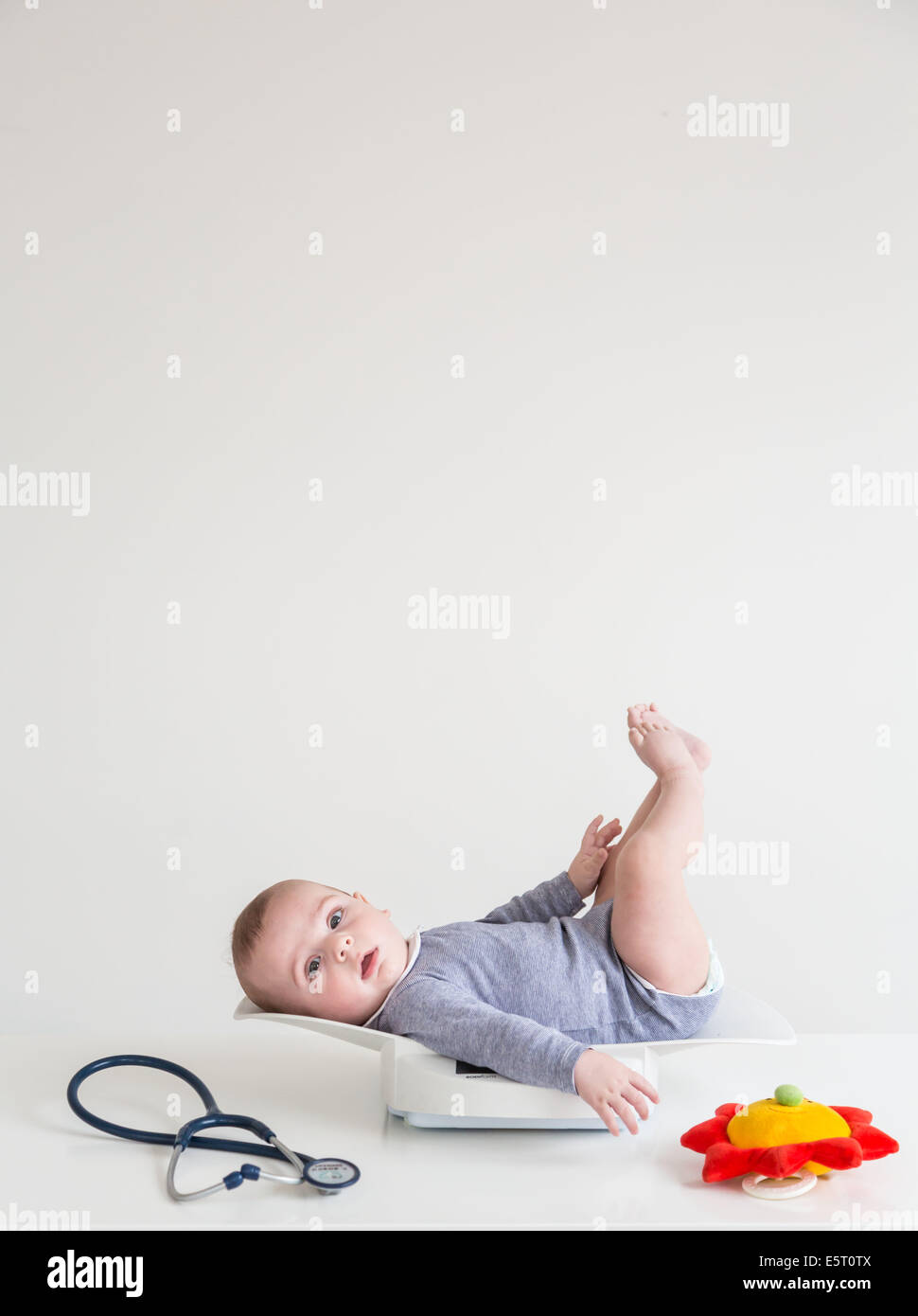 5 month old baby boy weighing. Stock Photo