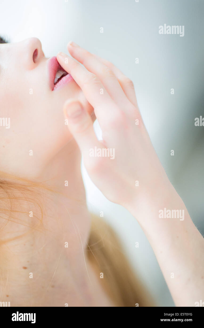 Woman touching her lips Stock Photo Alamy