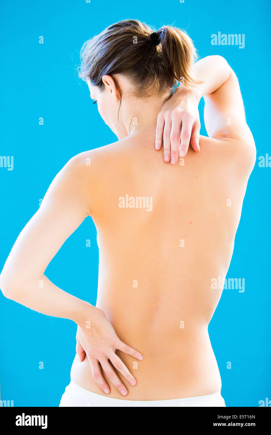 Woman suffering from neck and lumbar pain. Stock Photo