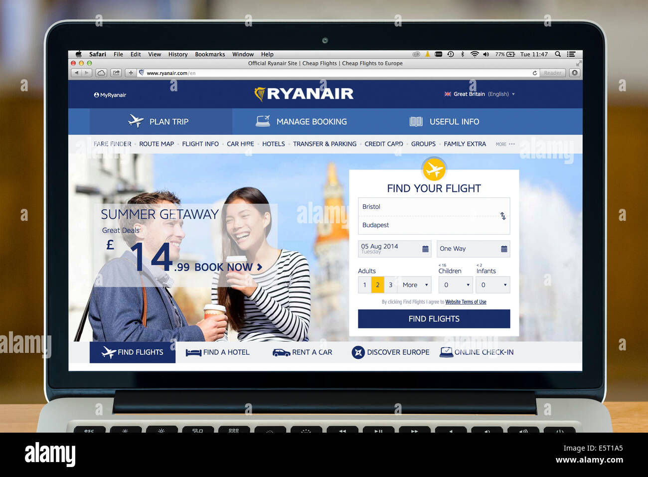 Booking a Ryanair flight on a 13' Apple MacBook Pro computer, UK Stock Photo