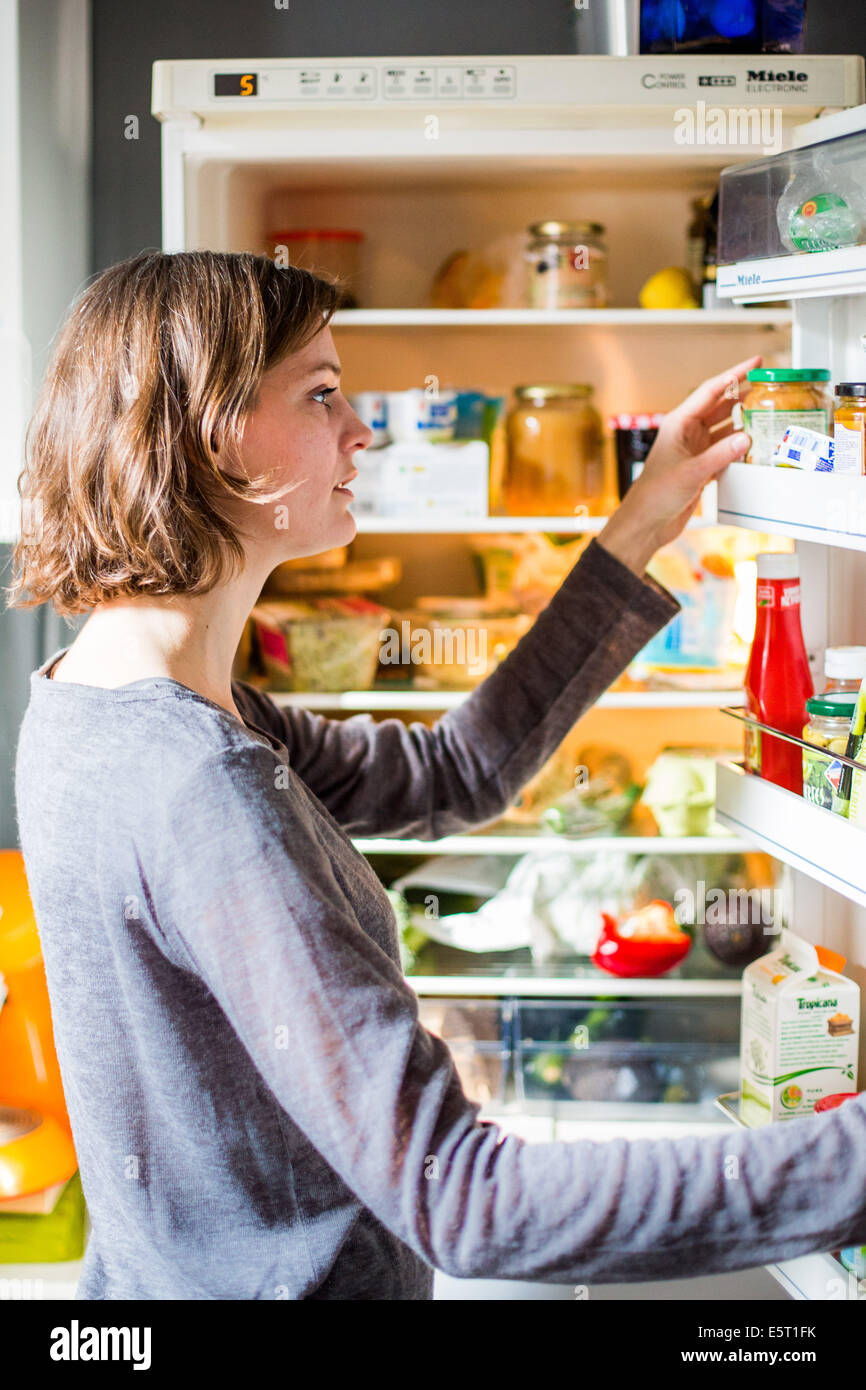 Woman checking the composition and nutrition facts Stock Photo - Alamy